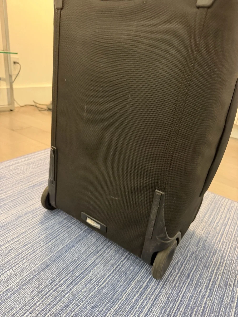 Tumi Black Softside Carry-On with Front Zip Pocket